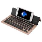 F18 Ultra-slim Rechargeable Foldable 58 Keys Bluetooth Wireless Keyboard with Holder (Gold) - 1