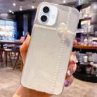 For iPhone 16 Pearl Bow Glitter Epoxy TPU Phone Case(Cross Knots) - 1