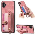 For Samsung Galaxy A04e Retro Cross Wristband Wallet Leather Back Phone Case(Pink) - 1