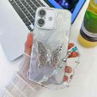 For iPhone 16 Plating Glitter Lens Film Texture Butterfly Holder Wristband Phone Case(White Feather Yarn) - 1