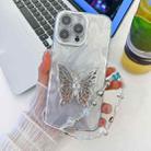 For iPhone 15 Pro Plating Glitter Lens Film Texture Butterfly Holder Wristband Phone Case(White Feather Yarn) - 1