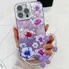 For iPhone 16 Pro Electroplating Flowers Plants Texture Wristband TPU Phone Case(Purple Flowers FL1) - 1