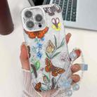 For iPhone 15 Pro Electroplating Flowers Plants Texture Wristband TPU Phone Case(Butterfly Love Flower FL17) - 1