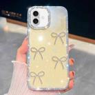 For iPhone 16 Diamond Glitter Bow-knot Four-Corner Shockproof Phone Case(Light Yellow) - 1