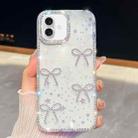 For iPhone 16 Plus Diamond Glitter Bow-knot Four-Corner Shockproof Phone Case(Transparent Stars) - 1
