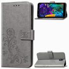 For LG K30 2019   Four-leaf Clasp Embossed Buckle Mobile Phone Protection Leather Case with Lanyard & Card Slot & Wallet & Bracket Function(Gray) - 1