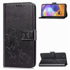 For Galaxy A31 Four-leaf Clasp Embossed Buckle Mobile Phone Protection Leather Case with Lanyard & Card Slot & Wallet & Bracket Function(Black) - 1