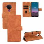 For Nokia 5.4 Solid Color Skin Feel Magnetic Buckle Horizontal Flip Calf Texture PU Leather Case with Holder & Card Slots & Wallet(Brown)