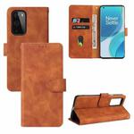 For OnePlus 9 Solid Color Skin Feel Magnetic Buckle Horizontal Flip Calf Texture PU Leather Case with Holder & Card Slots & Wallet(Brown)