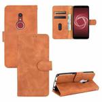 For Fujitsu Be4 Plus F-41B Solid Color Skin Feel Magnetic Buckle Horizontal Flip Calf Texture PU Leather Case with Holder & Card Slots & Wallet(Brown)