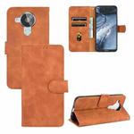 For Nokia 7.3 Solid Color Skin Feel Magnetic Buckle Horizontal Flip Calf Texture PU Leather Case with Holder & Card Slots & Wallet(Brown)