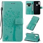 For Motorola Moto E7 Tree & Cat Pattern Pressed Printing Horizontal Flip PU Leather Case with Holder & Card Slots & Wallet & Lanyard(Green)