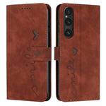 For Sony Xperia 1 V 2023 Skin Feel Heart Embossed Leather Phone Case with Long Lanyard(Brown)