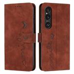 For Sony Xperia 1 VI Skin Feel Heart Embossed Leather Phone Case with Long Lanyard(Brown)