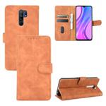 For Xiaomi Redmi 9 Solid Color Skin Feel Magnetic Buckle Horizontal Flip Calf Texture PU Leather Case with Holder & Card Slots & Wallet(Brown)