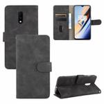For OnePlus 7 Solid Color Skin Feel Magnetic Buckle Horizontal Flip Calf Texture PU Leather Case with Holder & Card Slots & Wallet(Black)