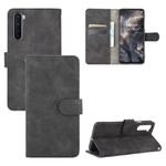 For OnePlus Nord Solid Color Skin Feel Magnetic Buckle Horizontal Flip Calf Texture PU Leather Case with Holder & Card Slots & Wallet(Black)