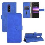 For Sony Xperia 1 Solid Color Skin Feel Magnetic Buckle Horizontal Flip Calf Texture PU Leather Case with Holder & Card Slots & Wallet(Blue)