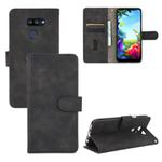 For LG K40S Solid Color Skin Feel Magnetic Buckle Horizontal Flip Calf Texture PU Leather Case with Holder & Card Slots & Wallet(Black)