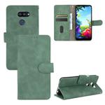 For LG K40S Solid Color Skin Feel Magnetic Buckle Horizontal Flip Calf Texture PU Leather Case with Holder & Card Slots & Wallet(Green)