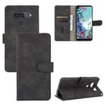 For LG Q70 Solid Color Skin Feel Magnetic Buckle Horizontal Flip Calf Texture PU Leather Case with Holder & Card Slots & Wallet(Black)