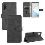 For Samsung Galaxy Note10 Plus Solid Color Skin Feel Magnetic Buckle Horizontal Flip Calf Texture PU Leather Case with Holder & Card Slots & Wallet(Black)