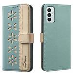 For Samsung Galaxy A23 / M23 / M13 4G Splicing Color Hollow Flower Pattern RFID Leather Phone Case(Green)