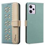 For Xiaomi Poco X5 Pro Splicing Color Hollow Flower Pattern RFID Leather Phone Case(Green)