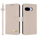 For Google Pixel 9a Metal Bow Leather Phone Case with Hand Strap(Apricot)