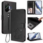 For Xiaomi Poco F7 5G / Redmi Turbo 4 Pro 5G Embossed Heart Cat Leather Phone Case with Hand Strap(Black)