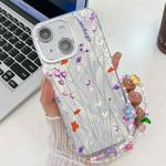 For iPhone 15 Electroplating Flower Texture Wristband TPU Phone Case(Purple Wildflowers SH1)