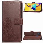 For Galaxy M30   Four-leaf Clasp Embossed Buckle Mobile Phone Protection Leather Case with Lanyard & Card Slot & Wallet & Bracket Function(Brown)