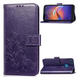 For Motorola E6 Play Four-leaf Clasp Embossed Buckle Mobile Phone Protection Leather Case with Lanyard & Card Slot & Wallet & Bracket Function(Purple)