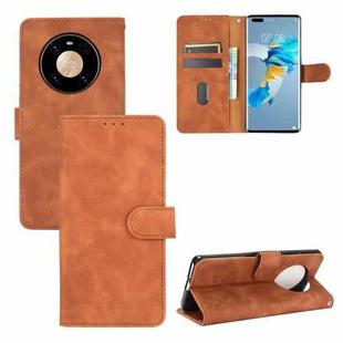For Huawei Mate 40 Pro Solid Color Skin Feel Magnetic Buckle Horizontal Flip Calf Texture PU Leather Case with Holder & Card Slots & Wallet(Brown)