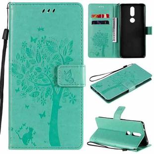 For Nokia 2.4 Tree & Cat Pattern Pressed Printing Horizontal Flip PU Leather Case with Holder & Card Slots & Wallet & Lanyard(Green)