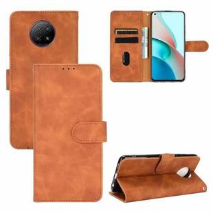 For Xiaomi Redmi Note 9 5G Solid Color Skin Feel Magnetic Buckle Horizontal Flip Calf Texture PU Leather Case with Holder & Card Slots & Wallet(Brown)