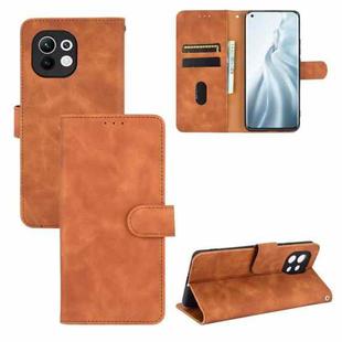 For Xiaomi Mi 11 Solid Color Skin Feel Magnetic Buckle Horizontal Flip Calf Texture PU Leather Case with Holder & Card Slots & Wallet(Brown)