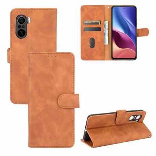 For Xiaomi Redmi K40 / K40 Pro Solid Color Skin Feel Magnetic Buckle Horizontal Flip Calf Texture PU Leather Case with Holder & Card Slots & Wallet(Brown)