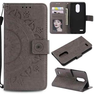 For LG K10 (2018) Totem Flower Embossed Horizontal Flip TPU + PU Leather Case with Holder & Card Slots & Wallet(Grey)
