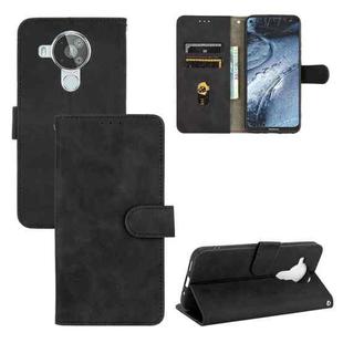 For Nokia 7.3 Solid Color Skin Feel Magnetic Buckle Horizontal Flip Calf Texture PU Leather Case with Holder & Card Slots & Wallet(Black)