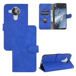 For Nokia 7.3 Solid Color Skin Feel Magnetic Buckle Horizontal Flip Calf Texture PU Leather Case with Holder & Card Slots & Wallet(Blue)