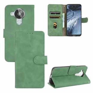 For Nokia 7.3 Solid Color Skin Feel Magnetic Buckle Horizontal Flip Calf Texture PU Leather Case with Holder & Card Slots & Wallet(Green)