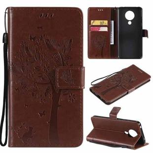 For Nokia 5.3 Tree & Cat Pattern Pressed Printing Horizontal Flip PU Leather Case with Holder & Card Slots & Wallet & Lanyard(Coffee)