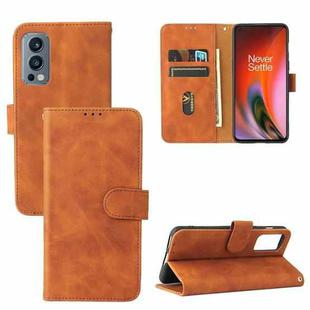 For OnePlus Nord 2 5G Solid Color Skin Feel Magnetic Buckle Horizontal Flip Calf Texture PU Leather Case with Holder & Card Slots & Wallet(Brown)