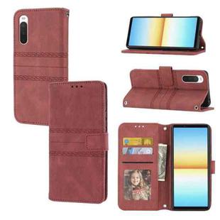 For Sony Xperia 10 IV Embossed Striped Magnetic Buckle Horizontal Flip Phone Leather Case(Red)