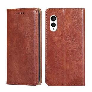 For Fujitsu Arrows N F-51C Gloss Oil Solid Color Magnetic Leather Phone Case(Brown)
