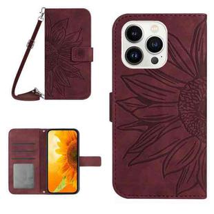 For iPhone 15 Pro Max Skin Feel Sun Flower Embossed Flip Leather Phone Case with Lanyard(Wine Red)