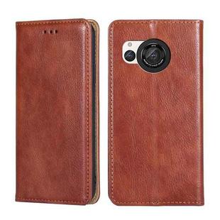 For Sharp Aquos R8 SH-52D Gloss Oil Solid Color Magnetic Leather Phone Case(Brown)