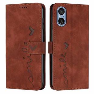 For Sony Xperia 5 V Skin Feel Heart Embossed Leather Phone Case with Long Lanyard(Brown)