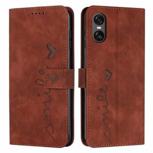 For Sony Xperia 5 VI Skin Feel Heart Embossed Leather Phone Case with Long Lanyard(Brown)